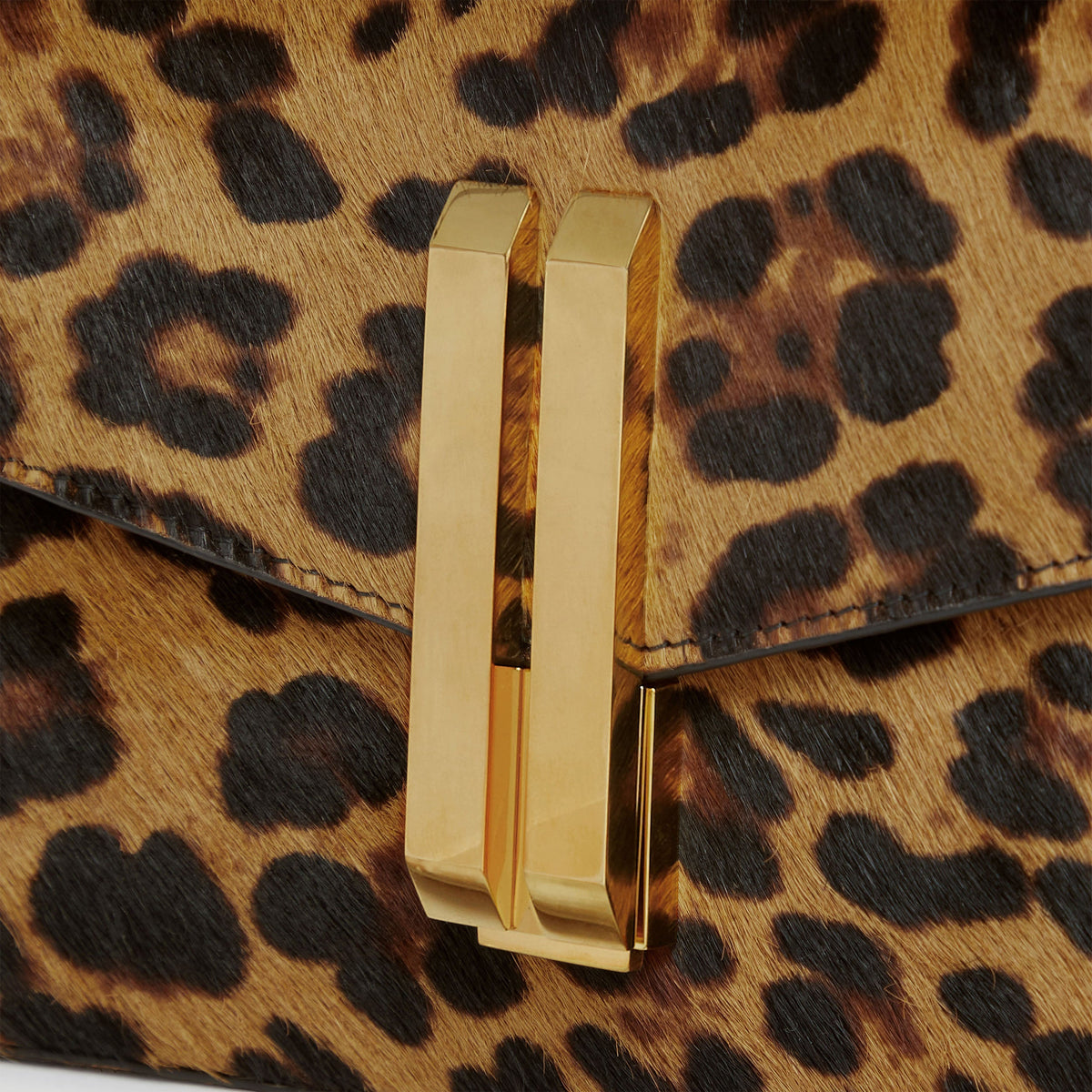 The Vancouver Clutch - leopard-effect calf hair & black smooth -