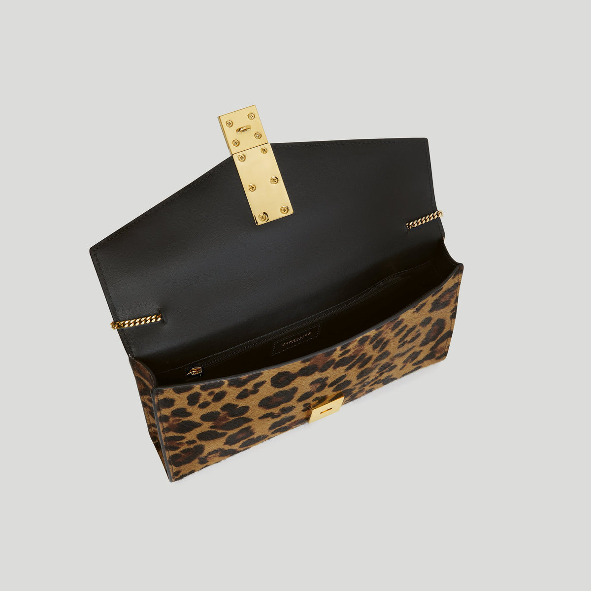 The Vancouver Clutch - leopard-effect calf hair & black smooth -